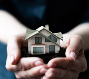 model-house-woman-s-hand-boxes-background