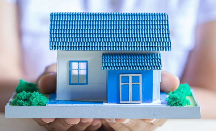 human-hands-holding-model-dream-house